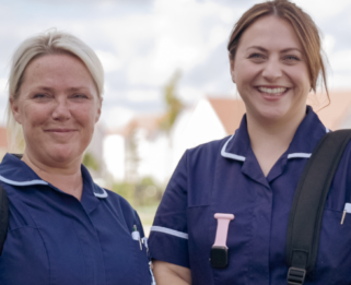 Two Fair Havens Community Nurses smiling at the camera