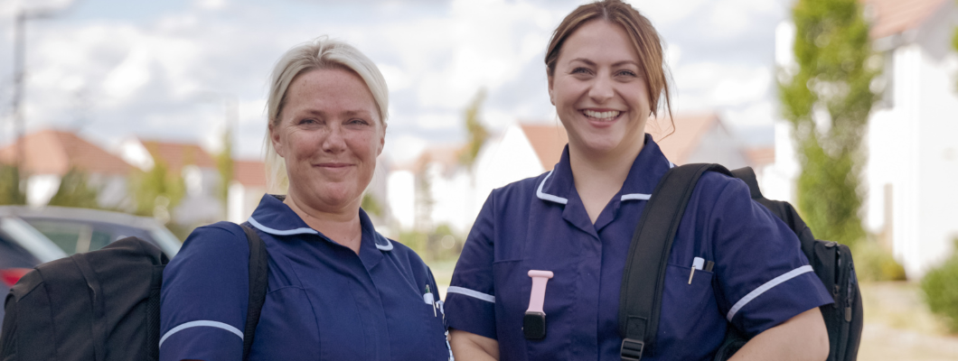 Two Fair Havens Community Nurses smiling at the camera