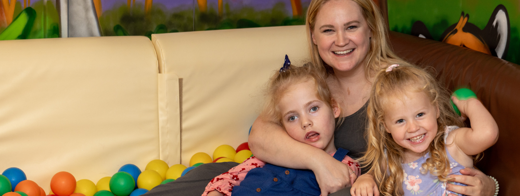 Little girl with her family in the Little Havens ball pit