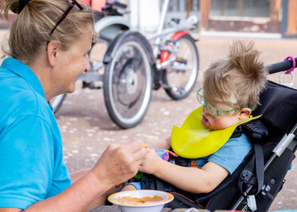 Little Havens Care Team member caring for a child in the hospice gardens