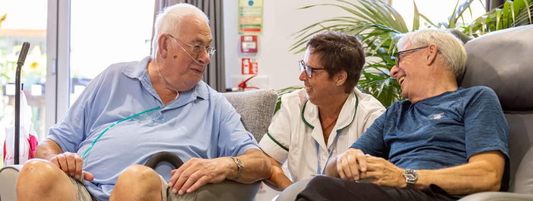 Occupational therapist laughing with two patients