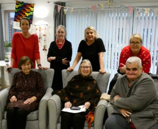 Group of men and women smiling in the reading round