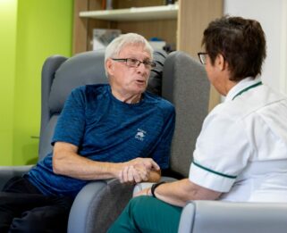Trevor chatting to a colleague at Fair Havens.