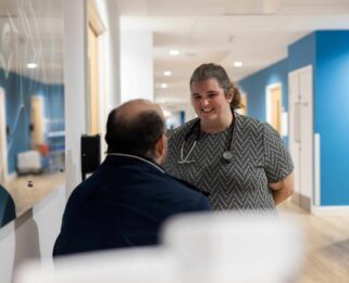 Dr Rachael talking to a family member in Fair Havens IPU