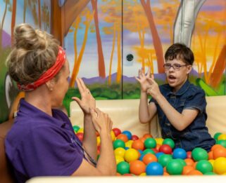 Hannah playing in the ball pit at Little Havens.