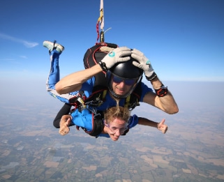 Tandem skydivers in the air.
