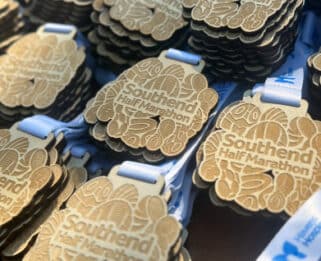 Close up of medals which read 'Southend Half'