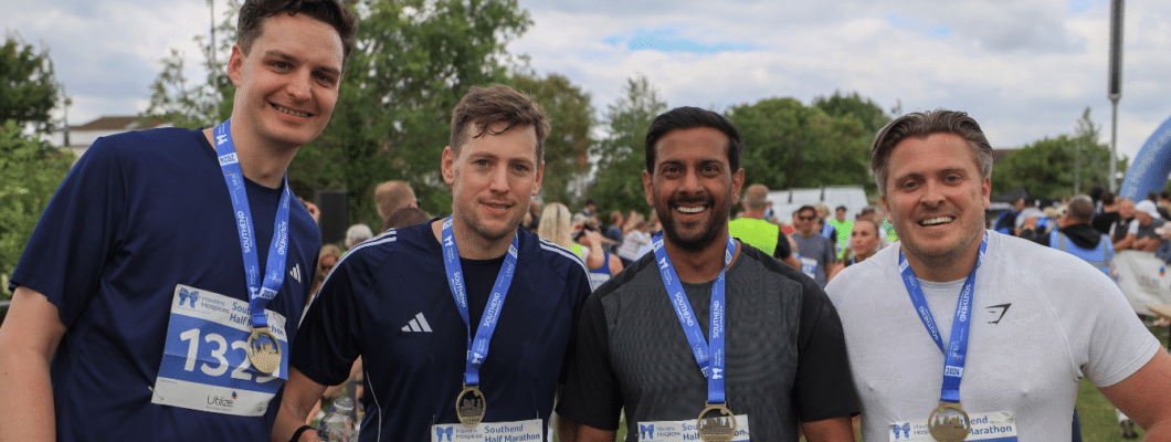 Runners with medal at finish line