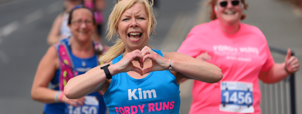 runner with hands in heart shape