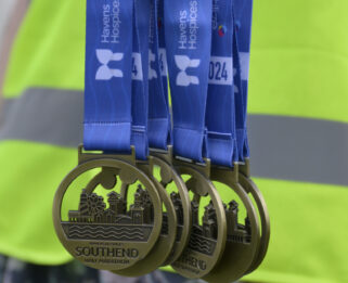 Several Southend Half 2024 medals hanging in the centre of the image