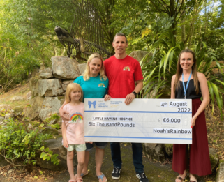 Ella, Kat, Nick and Wright with a cheque.