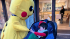Archie meeting Pikachu in the garden at Little Havens