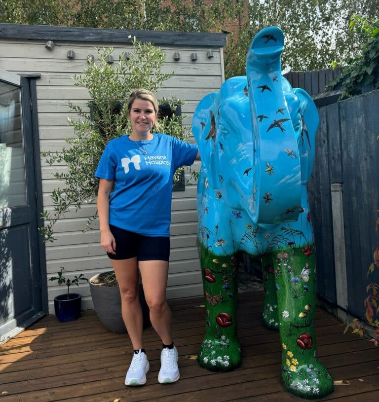 Kat Smith wearing a Havens Hospices t-shirt With The Elephant Sculpture From Herd In The City Which She Purchased After The Trail To Raise Funds For Havens Hospices