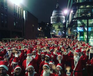Lots of people dressed up as santa in the streets of London