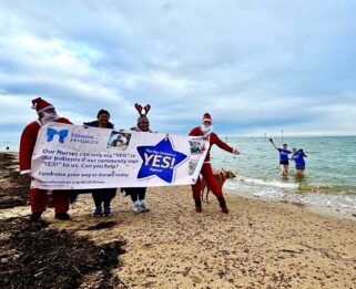 The Freezing Cold Fundraisers on the beach.