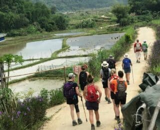 People trekking through Vietnam.