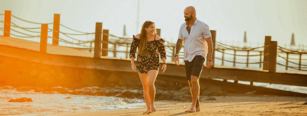 Paul and his partner Carys on the beach