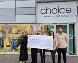 Members of Havens Hospices and Choice holding cheque