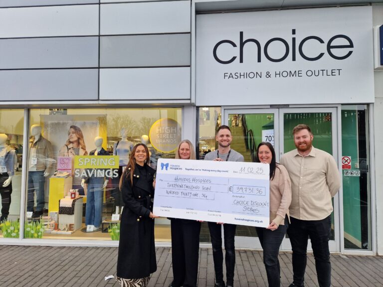 Members of Havens Hospices and Choice holding cheque
