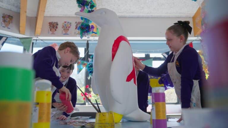 Grove Wood Primary School painting their penguin.