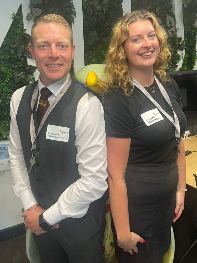 Scott and Lauren from Stibbards and Sons Ltd with penguin Poppy
