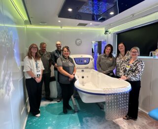 Community Champions from Morrisons' with colleagues from Havens Hospices in the new bathroom.