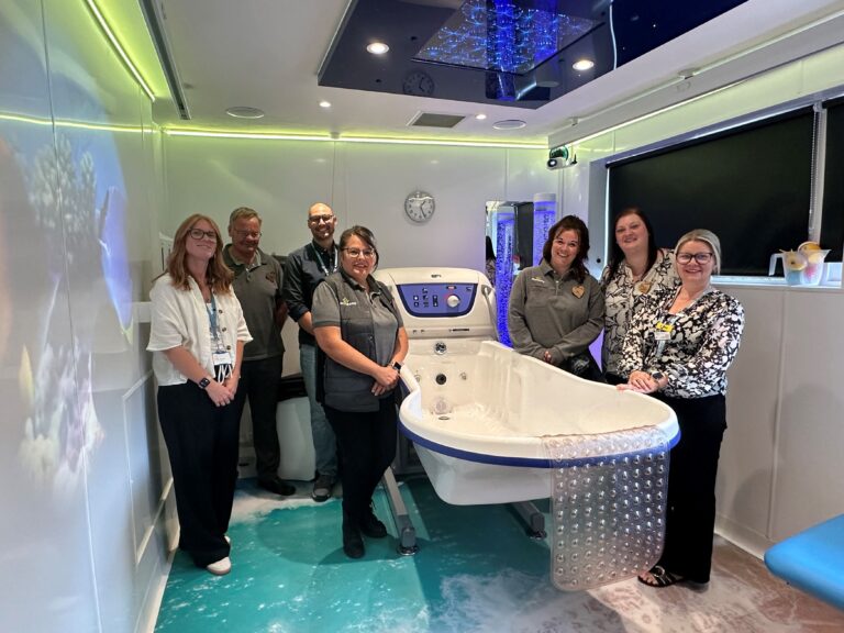 Community Champions from Morrisons' with colleagues from Havens Hospices in the new bathroom.