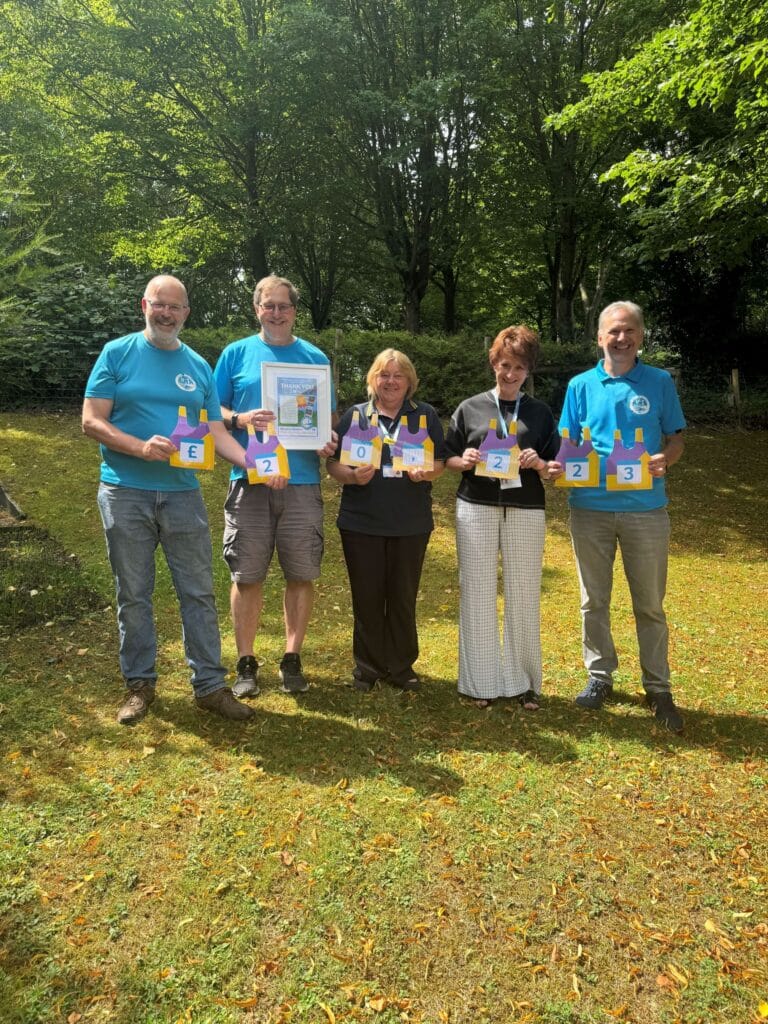 Three members of Roach Valley Relay at Little Havens with Judy , Head of Fundraising and a Little Havens care team member.