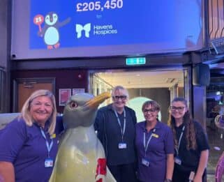 Little Havens care team with sculpture Poppy.