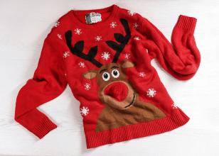 Christmas rudolph jumper flat on table
