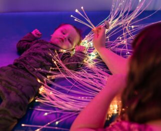 Mason in the sensory room at Little Havens.