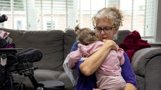 Mya and community carer at home