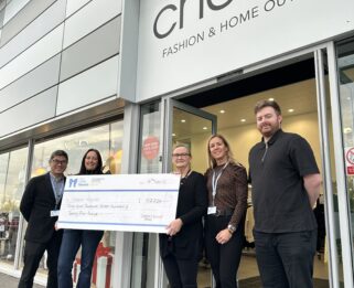 Representatives from choice and Havens hospices outside store with a cheque.