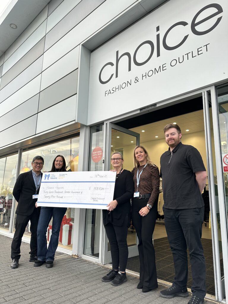 Representatives from choice and Havens hospices outside store with a cheque.