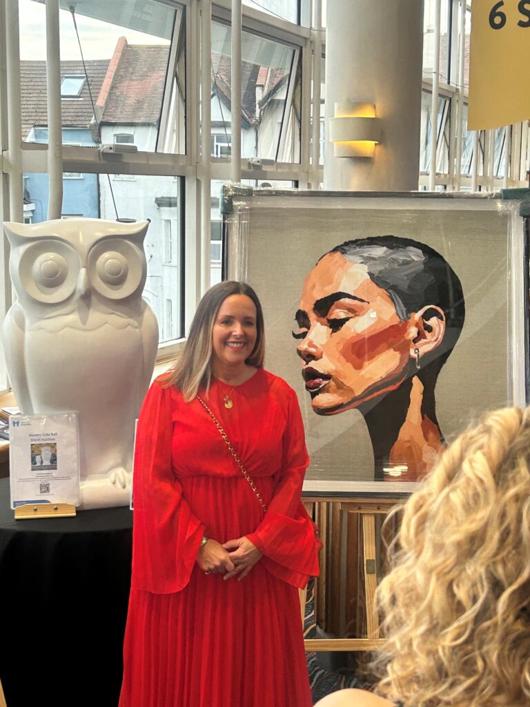 Zara Muse with her portrait donated to Little Havens at the Havens Hospices Gala Ball