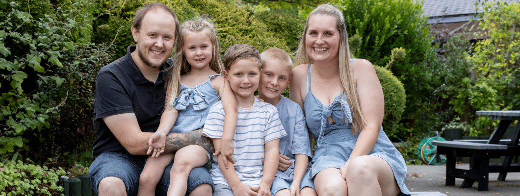 Isaac and family sat outside in garden