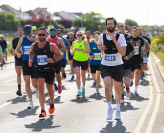 People running along East Beach Southend