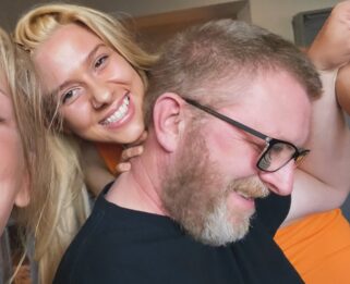 Young girl smiling hugging her Dad.