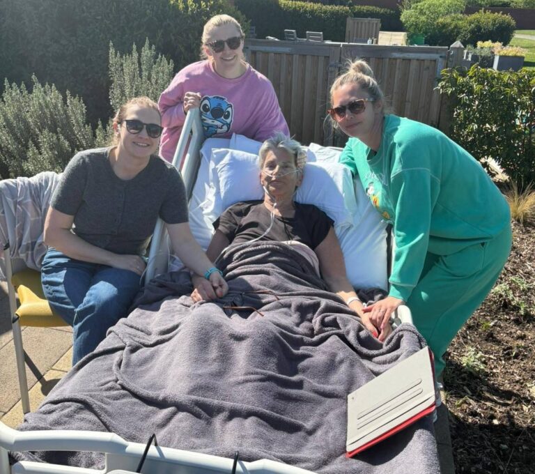 Zara surrounded by her daughters in the garden at Fair Havens