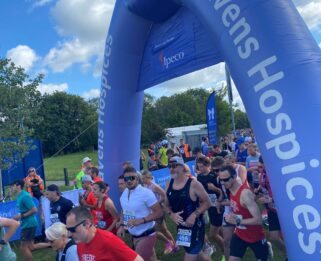 Lots of runners under the start line of the Southend Half Marathon.