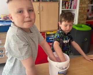Oliver and his brother making hand cast together