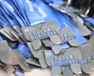 Medals with Race4Business on them