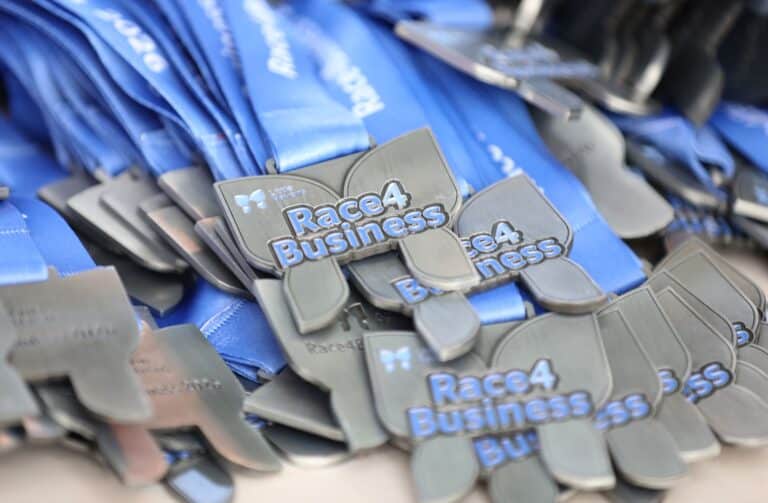 Medals with Race4Business on them