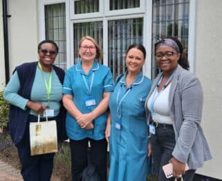 Blessing and Bea with two healthcare assistants in the community