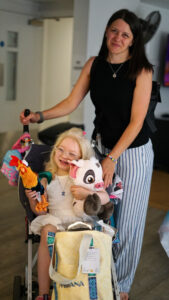 Nicol and her mum with Moana plushies