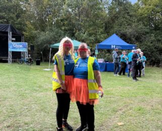 Amy and Dawn at Glow for Havens wearing bright outfits in 2025