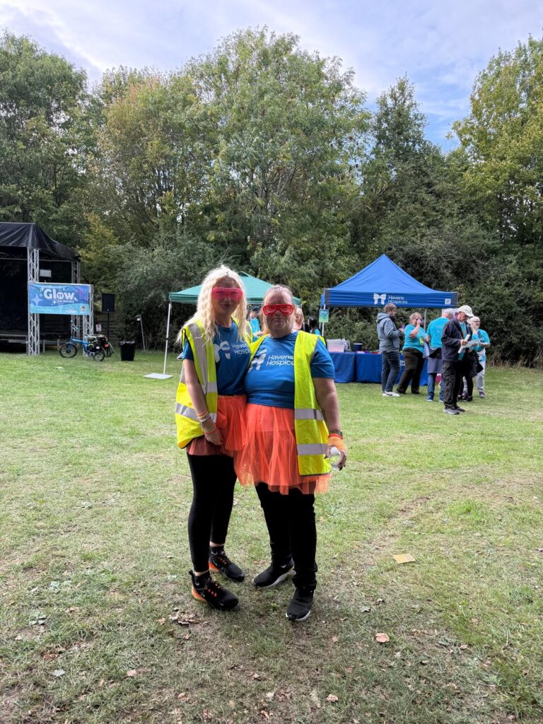 Amy and Dawn at Glow for Havens wearing bright outfits in 2025